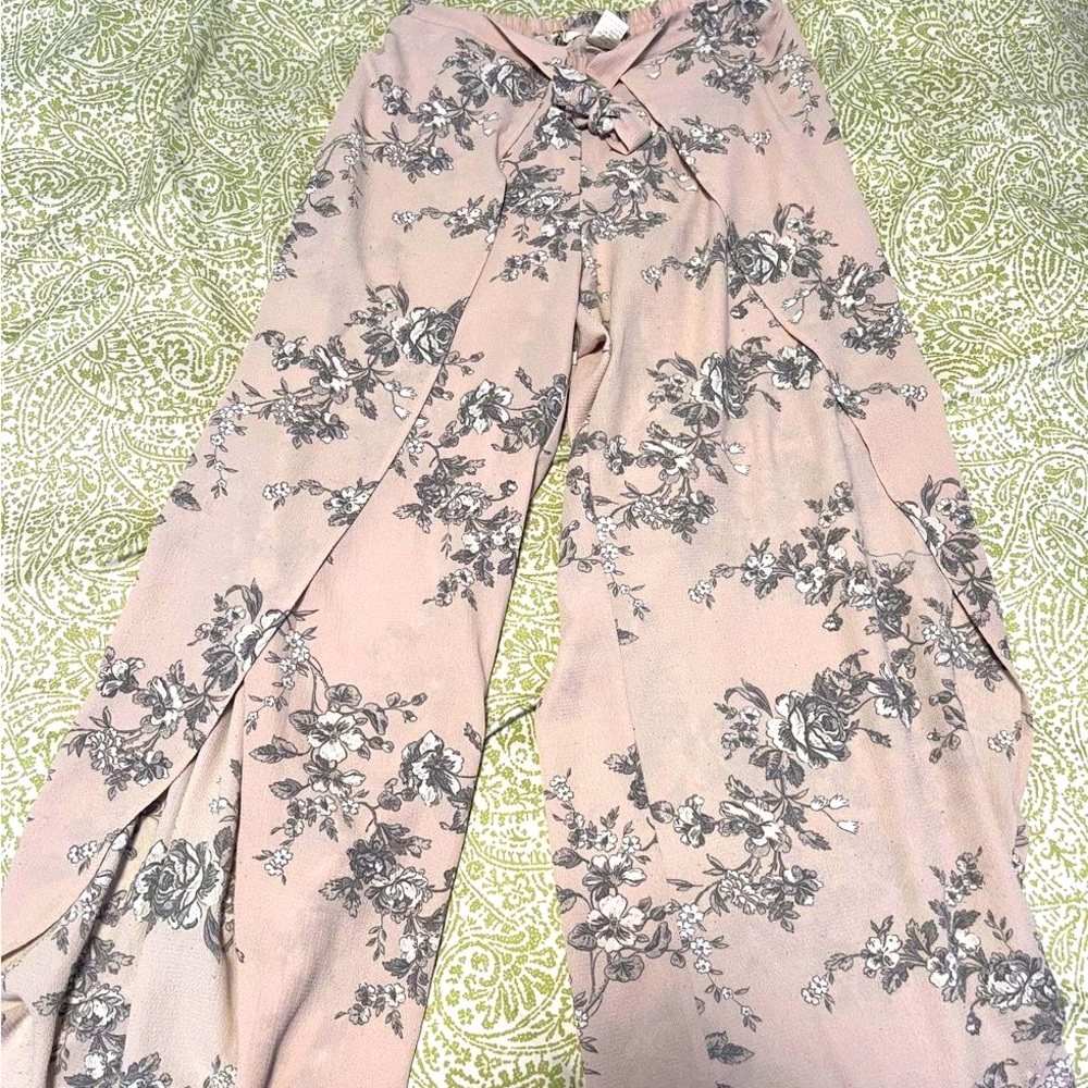 Lilac wide leg pant with split hem detail on both legs.